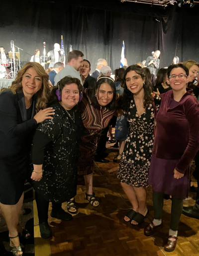 5 people posing together at ETTA gala.
