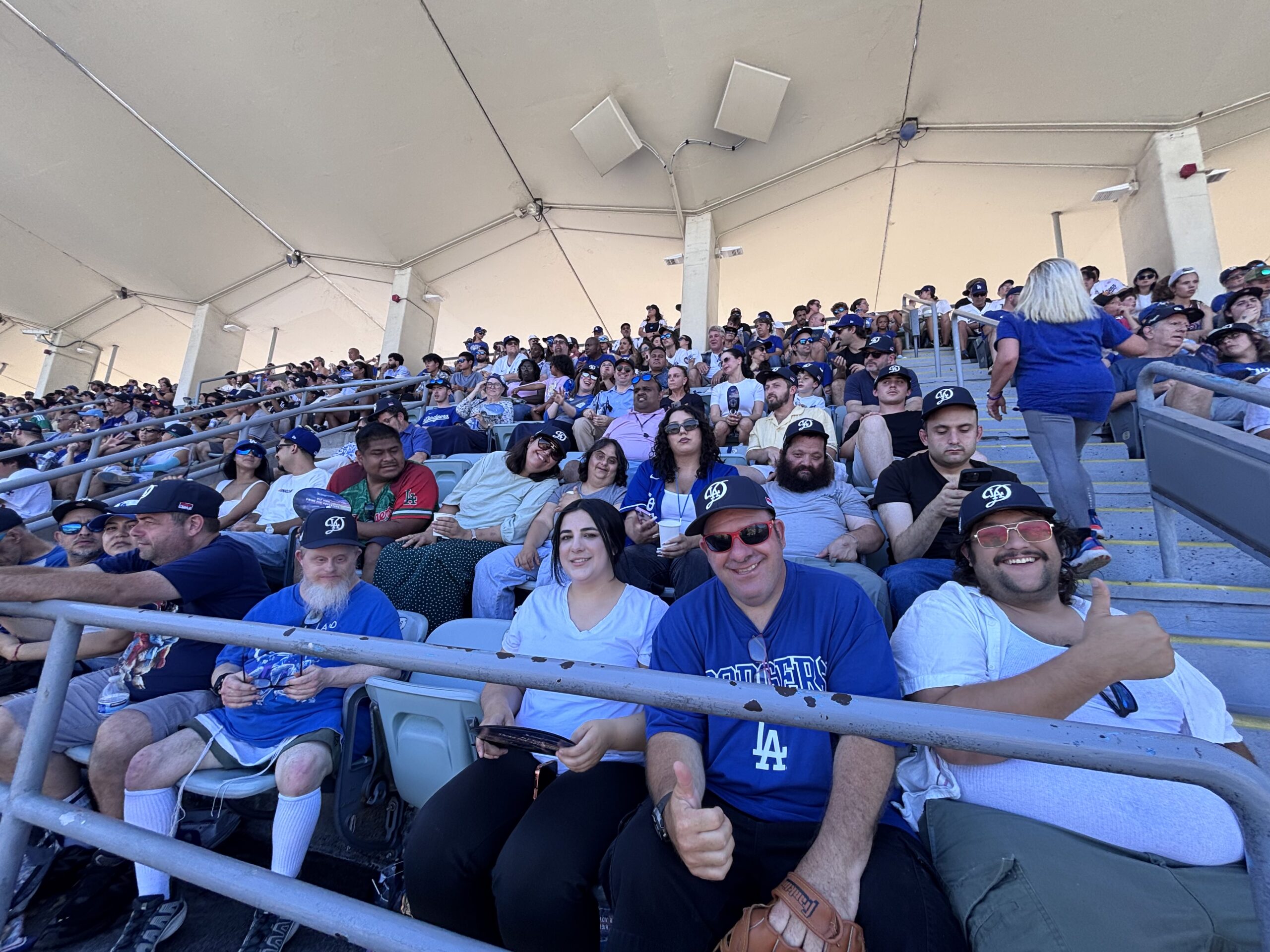 large group of etta and village dodgers fans smiling in stands
